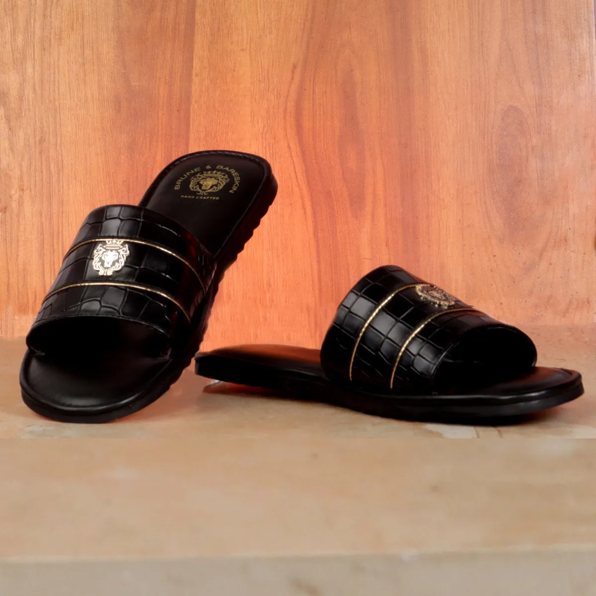 Black Deep Cut Croco Leather With Signature Metal Lion Slide-In-Slippers by BRUNE BY BARESKIN